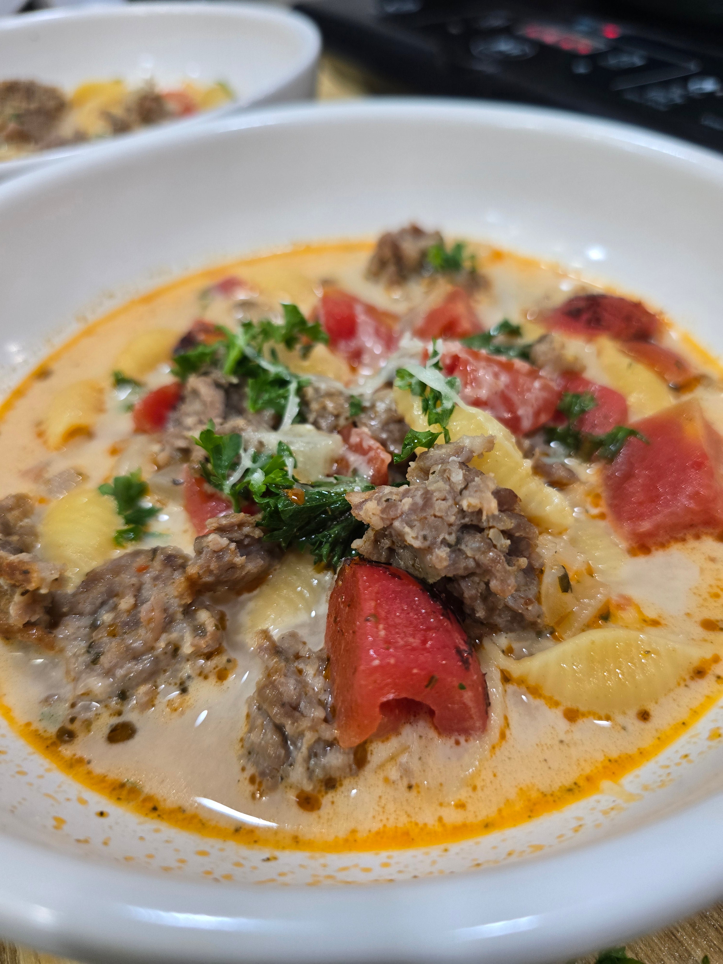 Creamy sausage and shells soup