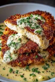 Crispy Parmesan crusted chicken in garlic cream sauce